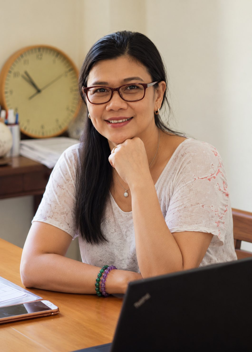 Ibu Wulan Rai Suci at her desk