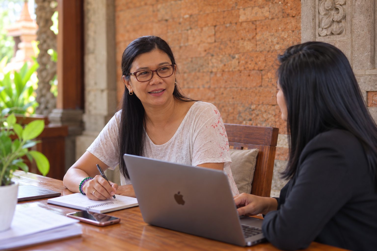 Ibu Wulan in discussion with a client